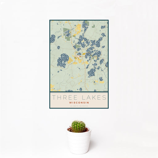 12x18 Three Lakes Wisconsin Map Print Portrait Orientation in Woodblock Style With Small Cactus Plant in White Planter