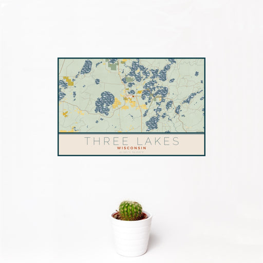 12x18 Three Lakes Wisconsin Map Print Landscape Orientation in Woodblock Style With Small Cactus Plant in White Planter