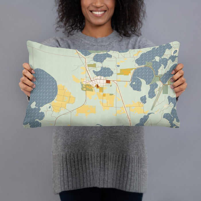 Person holding 20x12 Custom Three Lakes Wisconsin Map Throw Pillow in Woodblock