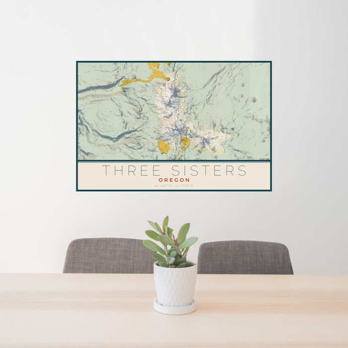 24x36 Three Sisters Oregon Map Print Lanscape Orientation in Woodblock Style Behind 2 Chairs Table and Potted Plant