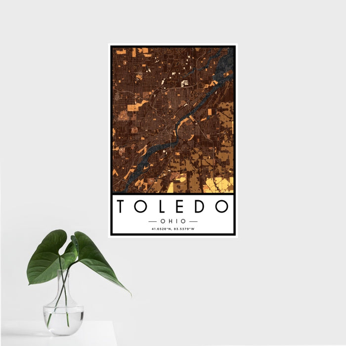 16x24 Toledo Ohio Map Print Portrait Orientation in Ember Style With Tropical Plant Leaves in Water