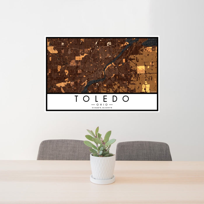 24x36 Toledo Ohio Map Print Landscape Orientation in Ember Style Behind 2 Chairs Table and Potted Plant