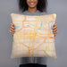 Person holding 18x18 Custom Topeka Kansas Map Throw Pillow in Watercolor