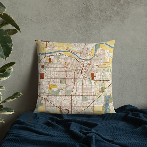 Custom Topeka Kansas Map Throw Pillow in Woodblock on Bedding Against Wall