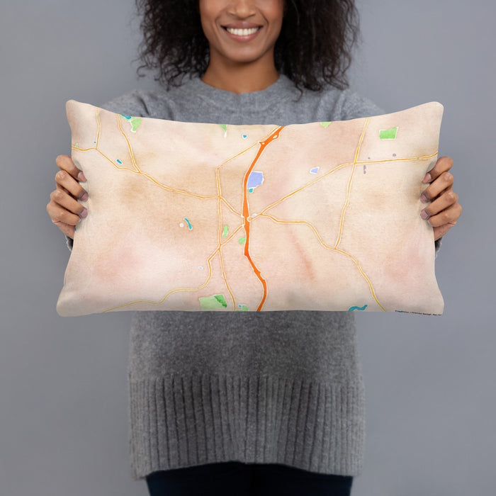 Person holding 20x12 Custom Torrington Connecticut Map Throw Pillow in Watercolor