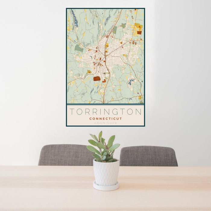 24x36 Torrington Connecticut Map Print Portrait Orientation in Woodblock Style Behind 2 Chairs Table and Potted Plant