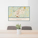 24x36 Torrington Connecticut Map Print Landscape Orientation in Woodblock Style Behind 2 Chairs Table and Potted Plant