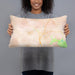 Person holding 20x12 Custom Travelers Rest South Carolina Map Throw Pillow in Watercolor