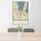 24x36 Traverse City Michigan Map Print Portrait Orientation in Woodblock Style Behind 2 Chairs Table and Potted Plant