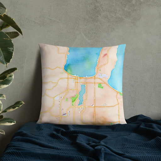 Custom Traverse City Michigan Map Throw Pillow in Watercolor on Bedding Against Wall