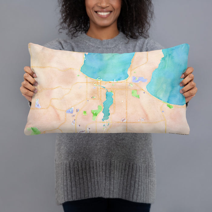 Person holding 20x12 Custom Traverse City Michigan Map Throw Pillow in Watercolor