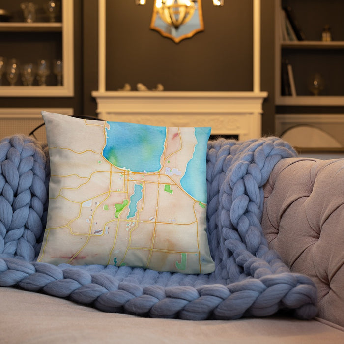 Custom Traverse City Michigan Map Throw Pillow in Watercolor on Cream Colored Couch