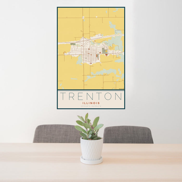24x36 Trenton Illinois Map Print Portrait Orientation in Woodblock Style Behind 2 Chairs Table and Potted Plant