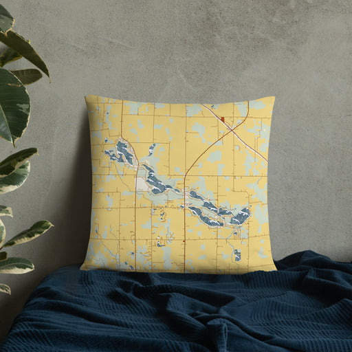 Custom Tri-Lakes Indiana Map Throw Pillow in Woodblock on Bedding Against Wall