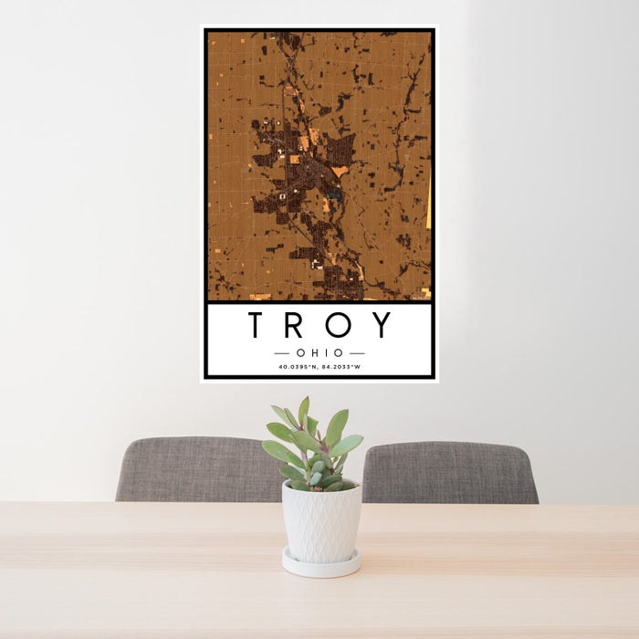 24x36 Troy Ohio Map Print Portrait Orientation in Ember Style Behind 2 Chairs Table and Potted Plant