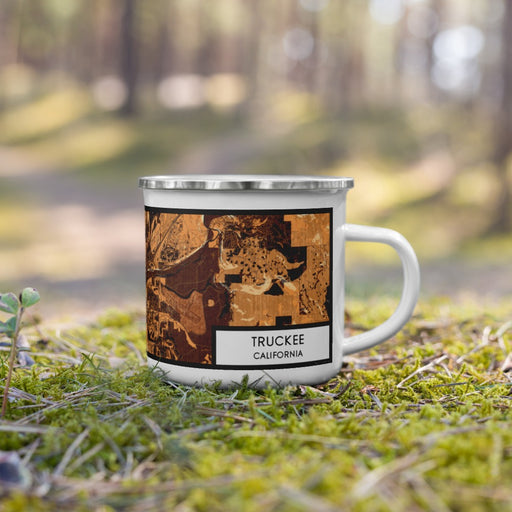 Right View Custom Truckee California Map Enamel Mug in Ember on Grass With Trees in Background