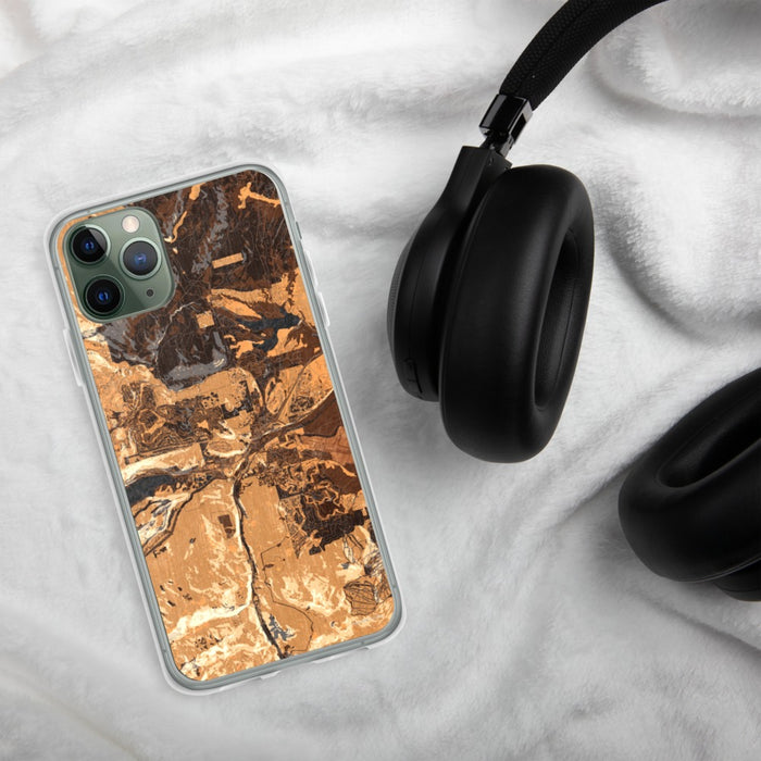 Custom Truckee California Map Phone Case in Ember on Table with Black Headphones