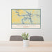 24x36 Truman Lake Missouri Map Print Lanscape Orientation in Woodblock Style Behind 2 Chairs Table and Potted Plant