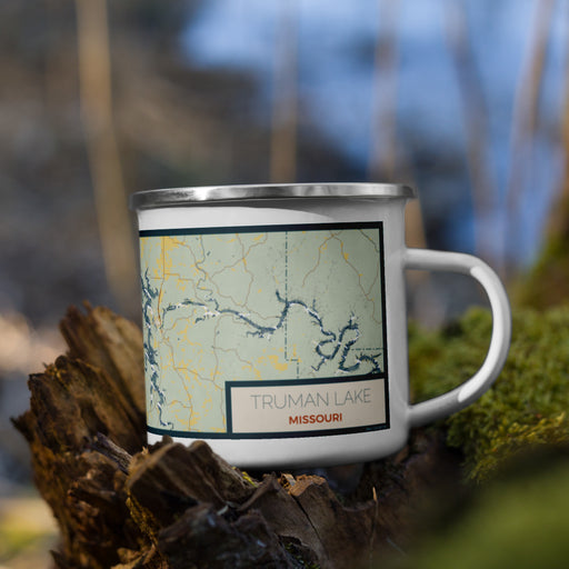 Right View Custom Truman Lake Missouri Map Enamel Mug in Woodblock on Grass With Trees in Background