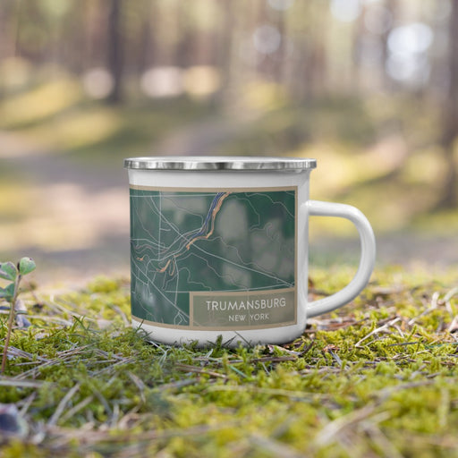 Right View Custom Trumansburg New York Map Enamel Mug in Afternoon on Grass With Trees in Background