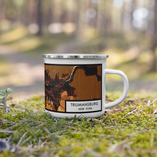 Right View Custom Trumansburg New York Map Enamel Mug in Ember on Grass With Trees in Background