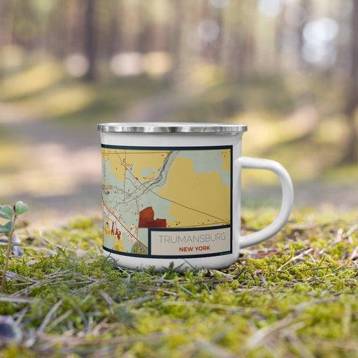 Right View Custom Trumansburg New York Map Enamel Mug in Woodblock on Grass With Trees in Background