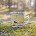 Right View Custom Trumansburg New York Map Enamel Mug in Woodblock on Grass With Trees in Background