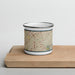 Front View Custom Tucker Georgia Map Enamel Mug in Woodblock on Cutting Board