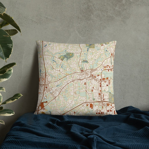 Custom Tucker Georgia Map Throw Pillow in Woodblock on Bedding Against Wall