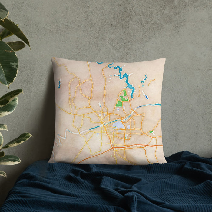 Custom Tuscaloosa Alabama Map Throw Pillow in Watercolor on Bedding Against Wall