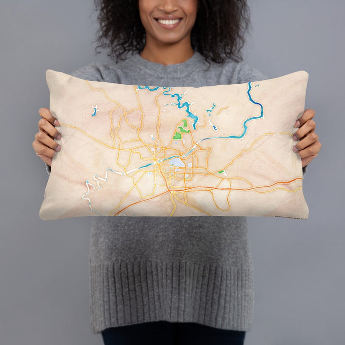 Person holding 20x12 Custom Tuscaloosa Alabama Map Throw Pillow in Watercolor