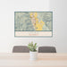 24x36 Ukiah California Map Print Lanscape Orientation in Woodblock Style Behind 2 Chairs Table and Potted Plant