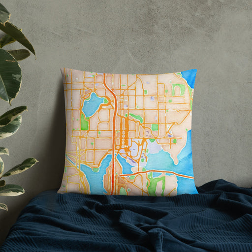Custom University District Seattle Map Throw Pillow in Watercolor on Bedding Against Wall
