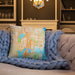 Custom University District Seattle Map Throw Pillow in Watercolor on Cream Colored Couch
