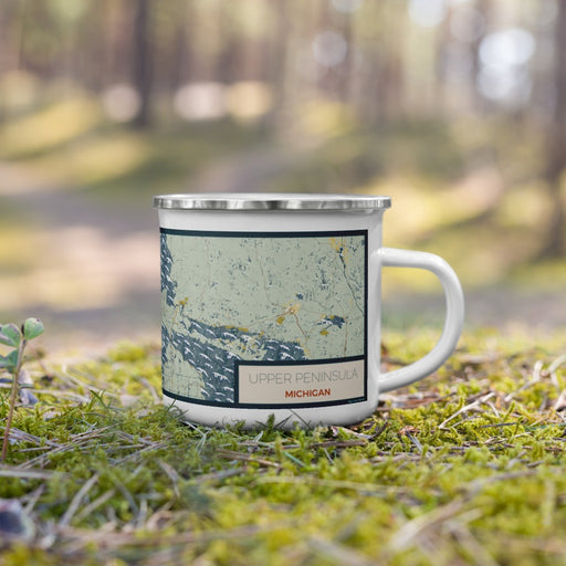 Right View Custom Upper Peninsula Michigan Map Enamel Mug in Woodblock on Grass With Trees in Background