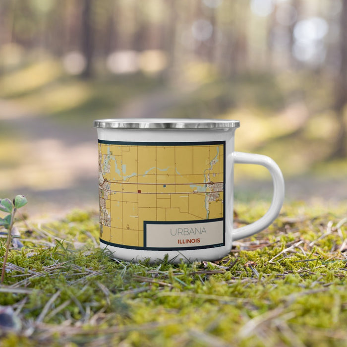 Right View Custom Urbana Illinois Map Enamel Mug in Woodblock on Grass With Trees in Background