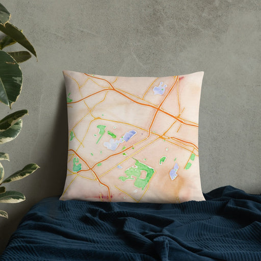 Custom Utica New York Map Throw Pillow in Watercolor on Bedding Against Wall