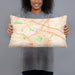 Person holding 20x12 Custom Utica New York Map Throw Pillow in Watercolor