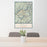 24x36 Vail Colorado Map Print Portrait Orientation in Woodblock Style Behind 2 Chairs Table and Potted Plant