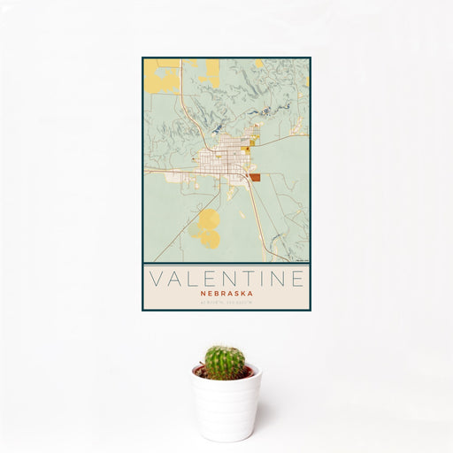 12x18 Valentine Nebraska Map Print Portrait Orientation in Woodblock Style With Small Cactus Plant in White Planter