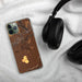 Custom Valentine Nebraska Map Phone Case in Ember on Table with Black Headphones