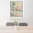 24x36 Vancouver Washington Map Print Portrait Orientation in Woodblock Style Behind 2 Chairs Table and Potted Plant