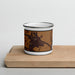 Front View Custom Vian Oklahoma Map Enamel Mug in Ember on Cutting Board