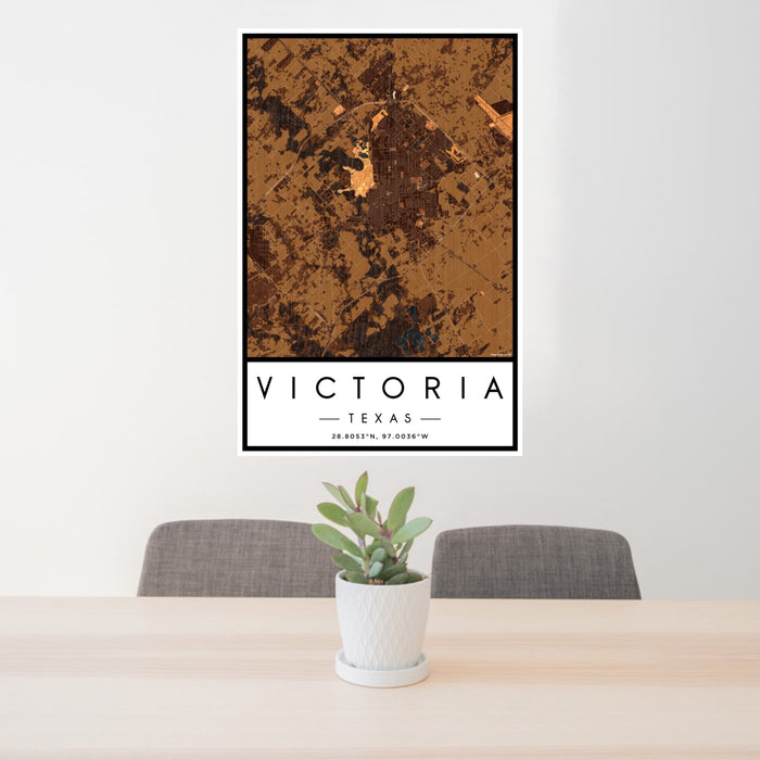 24x36 Victoria Texas Map Print Portrait Orientation in Ember Style Behind 2 Chairs Table and Potted Plant