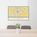 24x36 Victoria Texas Map Print Landscape Orientation in Woodblock Style Behind 2 Chairs Table and Potted Plant
