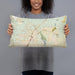 Person holding 20x12 Custom Victorville California Map Throw Pillow in Woodblock