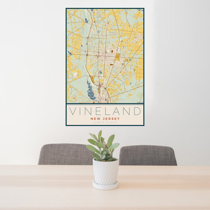 24x36 Vineland New Jersey Map Print Portrait Orientation in Woodblock Style Behind 2 Chairs Table and Potted Plant