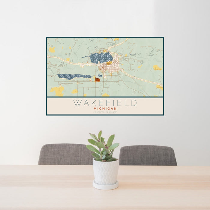 24x36 Wakefield Michigan Map Print Lanscape Orientation in Woodblock Style Behind 2 Chairs Table and Potted Plant