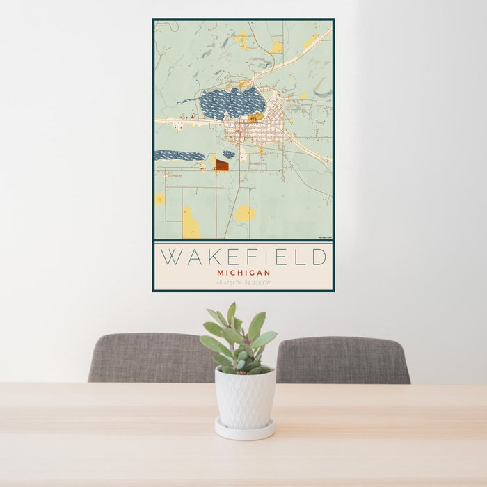 24x36 Wakefield Michigan Map Print Portrait Orientation in Woodblock Style Behind 2 Chairs Table and Potted Plant
