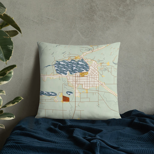 Custom Wakefield Michigan Map Throw Pillow in Woodblock on Bedding Against Wall